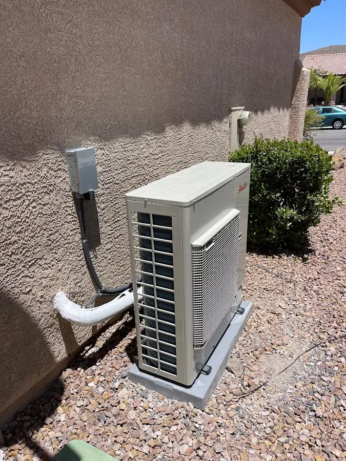 Residential air conditioning condenser unit in Winslow